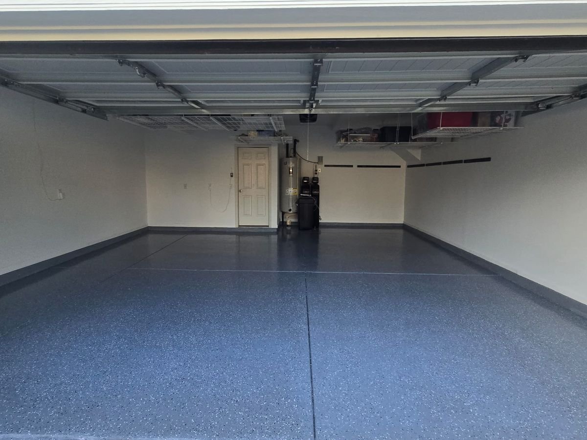 Garage after epoxy floor coating - glossy blue-gray flake finish, Eric's verified Google review project